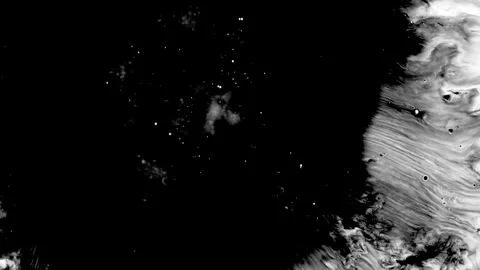 Spraying black paint on a white background Stock Footage 303171588