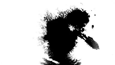 Spraying black paint on a white background Stock Footage 303171608
