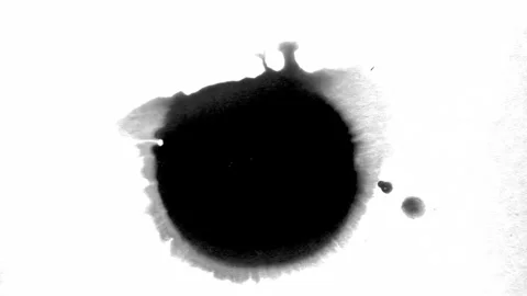 Spraying black paint on a white background Stock Footage 303171749