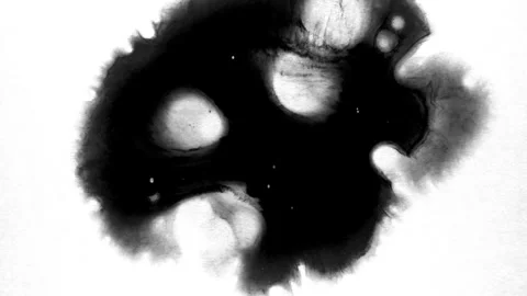 Spraying black paint on a white background Stock Footage 303171752