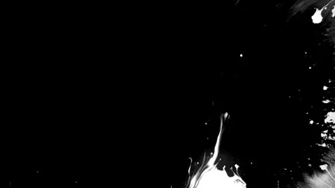 Spraying black paint on a white background Stock Footage 303171818