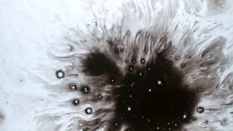 Spraying black paint on a white background Stock Footage 303171821