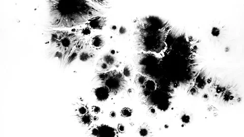 Spraying black paint on a white background Stock Footage 303171870