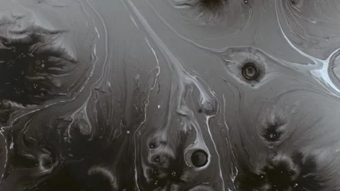 Spraying black paint on a white background Stock Footage 303171886