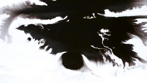 Spraying black paint on a white background Stock Footage 303171893