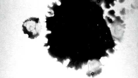 Spraying black paint on a white background Stock Footage 303171969