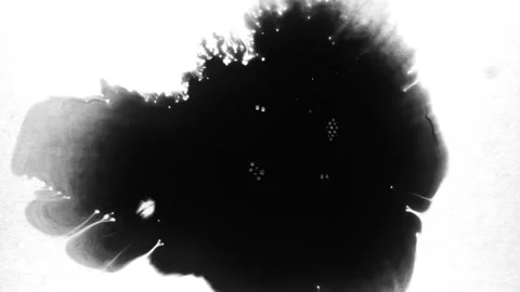 Spraying black paint on a white background 動画素材 305492637