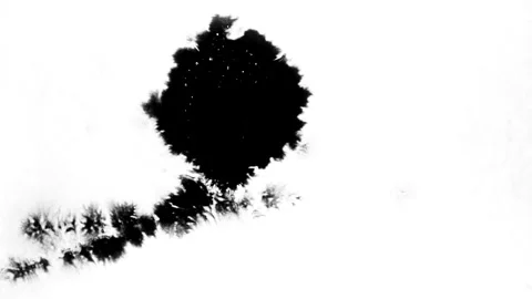 Spraying black paint on a white background Stock Footage 305492947