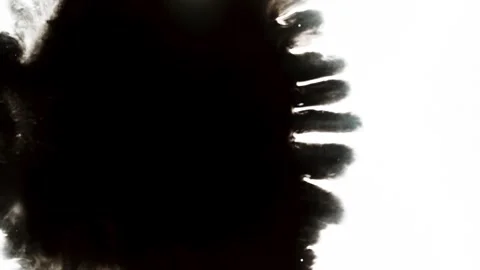Spraying black paint on a white background Stock Footage 305492981