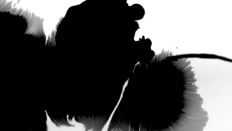 Spraying black paint on a white background Stock Footage 305492990