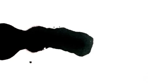 Spraying black paint on a white background Stock Footage 305493012