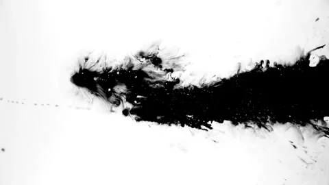 Spraying black paint on a white background Stock Footage 305493050