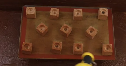 Spraying chocolate mousse cubes Stock Footage 289411122