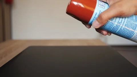 Spraying with cleaning solution on the table in slow motion Stock Footage 106028876