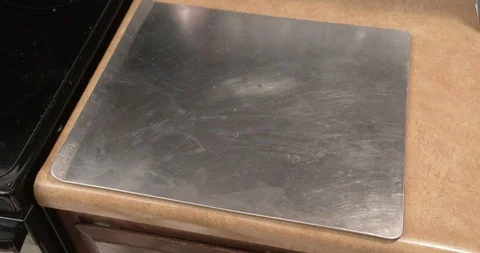 Spraying Cooking Spray on a Cookie Sheet Stock Footage 95615994