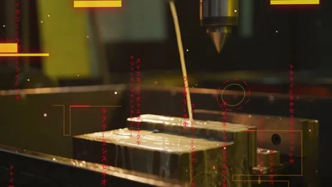 Spraying coolant stream striking metal block in vise at machine shop, with Stock Footage 332799780