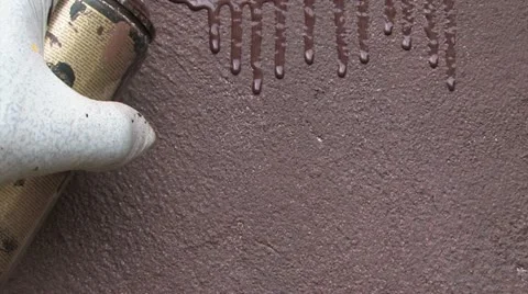 Spraying dark paint on a wall Stock Footage 11867250