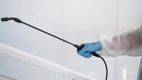 Spraying disinfectant in common areas to avoid COVID-19 Stock-Footage 157226874
