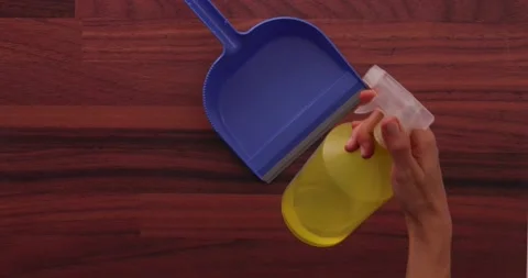 Spraying the dustpan 1 Stock Footage 132220451