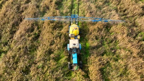 Spraying field at farm. Tractor use spray and irrigation method. 스톡 동영상 204017363