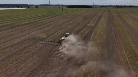 Spraying field. John Deere Tractor use spray and irrigation. Stock-Footage 211477333