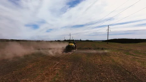 Spraying field. John Deere Tractor use spray and irrigation. Stock-Footage 212031881