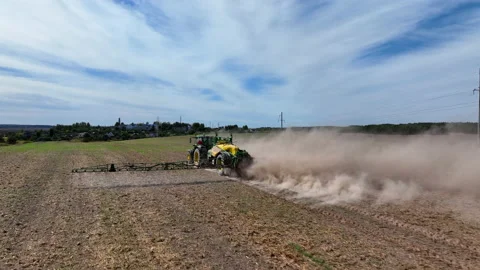 Spraying field. John Deere Tractor use spray and irrigation. Stock Footage 212117399