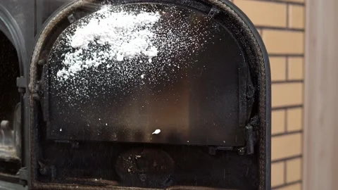 Spraying the fireplace window with a foamy detergent. Maintenance of the furnace Stock Footage 149036993