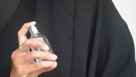 Spraying perfume on her body Stock-Footage 289028539