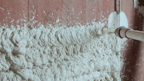 Spraying Plaster Onto Brick Wall with Special Nozzle Stock Footage 317381236