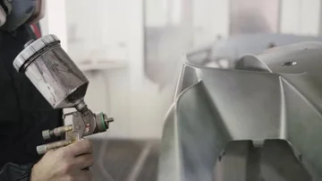 Spraying a poligh on a car bumper Stock Footage 85899050