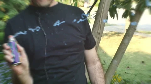 Spraying silly string spray Stock Footage 54392012