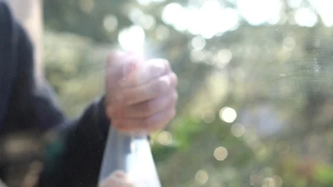 Spraying some Detergent on the Window, Slow Motion Stock Footage 122108877