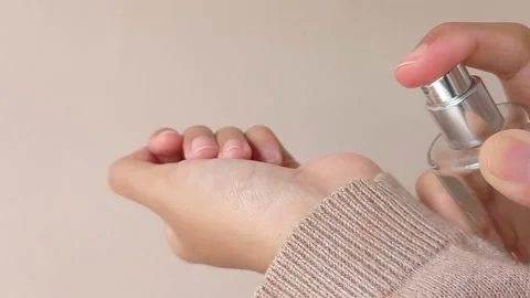 Spraying the sweet perfume to the hand Stock Footage 150523193