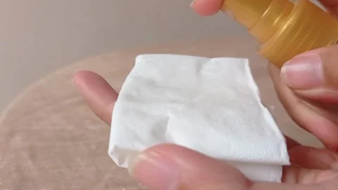 Spraying a toner into a cotton Stock Footage 146259344