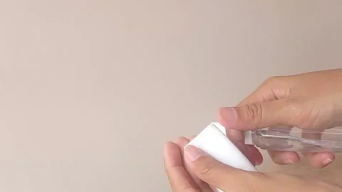 Spraying water from a bottle into a tissue Stock Footage 146255220