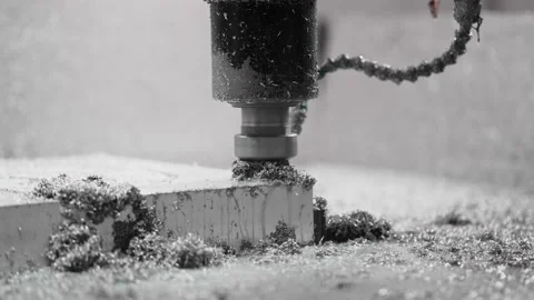 Spraying water in cooling CNC system. Metal chips when drilling hole metal form Stock Footage 167719916