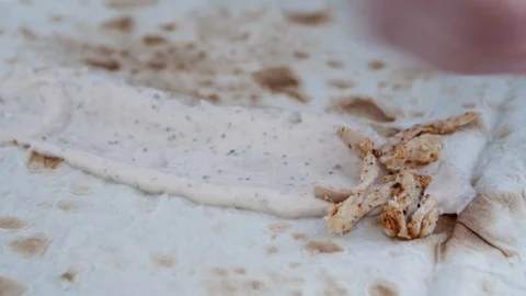 Spread boiled chicken meat with spices on lavash greased with sauce. Cooking  Stock Footage 106196282