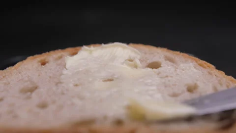 Spread butter on bread with knife 4k 스톡 동영상 148316939