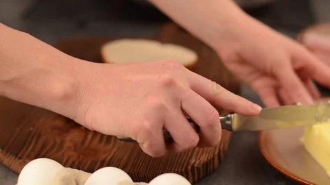 Spread butter on toast Stock Footage 76371592