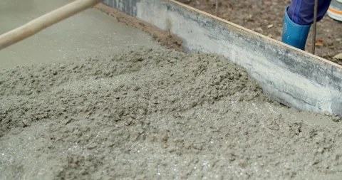 Spread the cement with a hoe.Pouring cement for smooth areas. Stock Footage 281237629