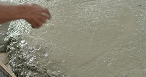 Spread the cement with Plastering trovel.Hand Holding Trowel and Smoothing. Stock Footage 281237646