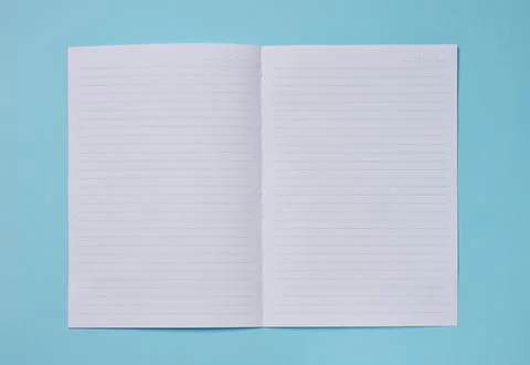 Spread of a clean lined notebook on a turquoise background. Stock Photos
