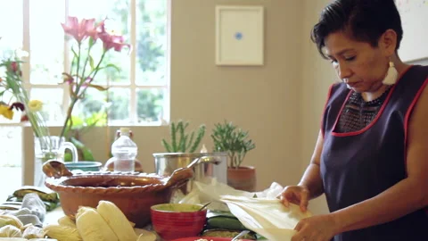 Spread corn dough masa for authentic mexican tamales 48 Stock Footage 135832394