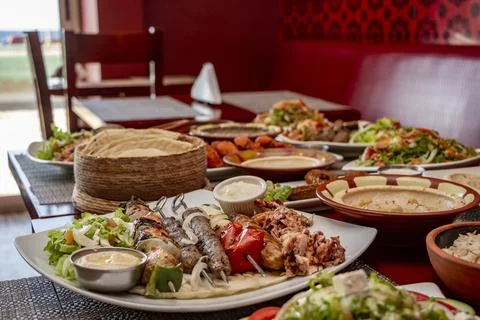 Spread of delicious kebab, flatbread and salad in a Middle Eastern restaurant Stock Photos