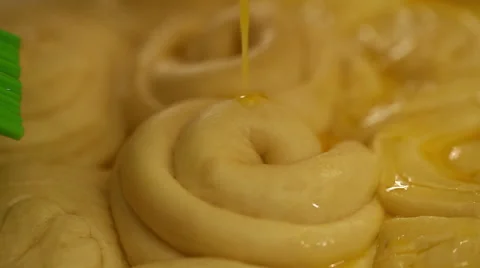 Spread with egg glaze on bread Stock Footage 54430139
