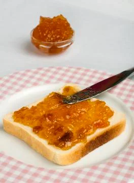 Spread jam on bread Stock Photos