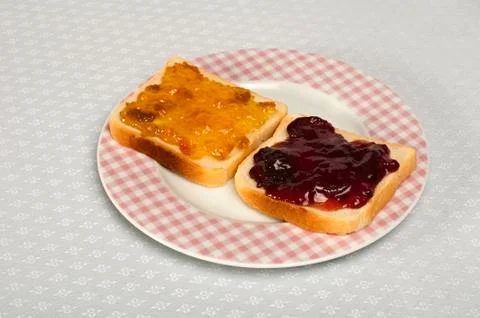 Spread jam on bread Stock Photos