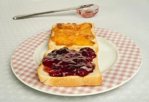 Spread jam on bread Stock Photos