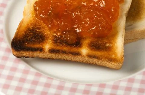 Spread jam on bread Spread jam on bread ,model released, Symbolfoto Copyri... Stock Photos